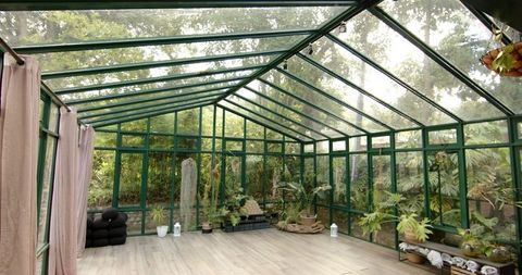 Tranquil Greenhouse Interior Ideal for Yoga and Meditation