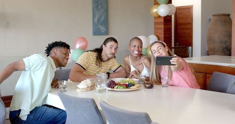 Friends Enjoying Lunch and Taking Selfie at Home