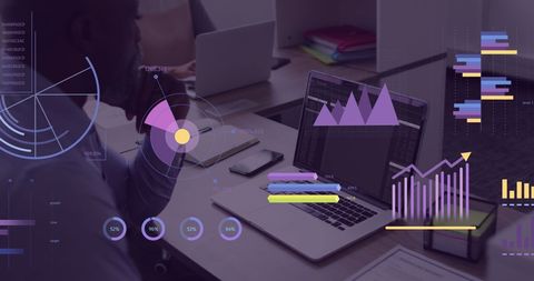 Businessman Analyzing Financial Metrics on Laptop