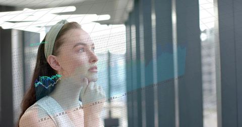 Young professional woman contemplating financial charts overlaying office glass, data analysis insig