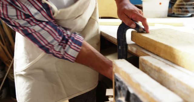 Craftsman clamping wooden board in workshop - Download Free Stock Images Pikwizard.com