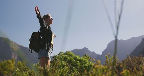 Woman Embracing Nature on Mountain Hike - Download Free Stock Images Pikwizard.com