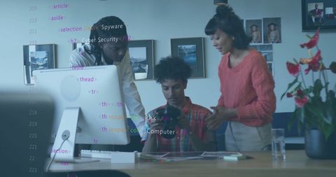 Diverse Professionals Analyzing Digital Data in Modern Office