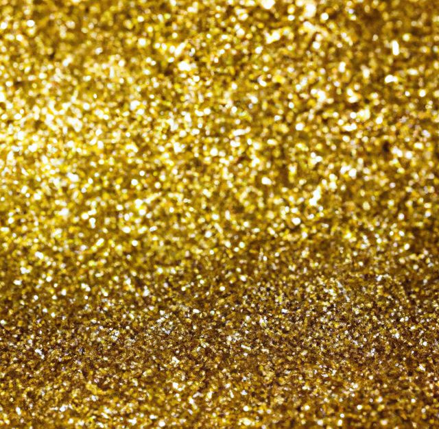 Close-up of a golden glitter sparkling texture, showing tiny reflective particles. Ideal for festive, celebratory, or glamorous designs, party invitations, holiday-themed graphics, and luxury branding materials.