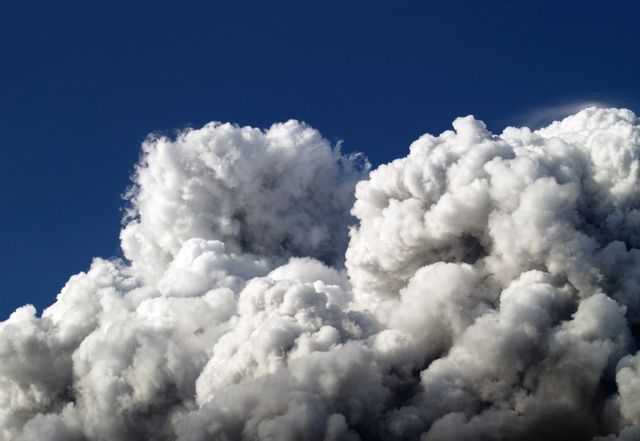 Dramatic Cumulus Cloudscape Against Clear Blue Sky - Download Free Stock Photos Pikwizard.com