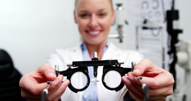 Optometrist Holding Phoropter for Eye Examination - Download Free Stock Images Pikwizard.com