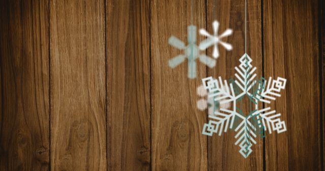 Festive Snowflakes on Wooden Background for Christmas Celebrations - Download Free Stock Images Pikwizard.com