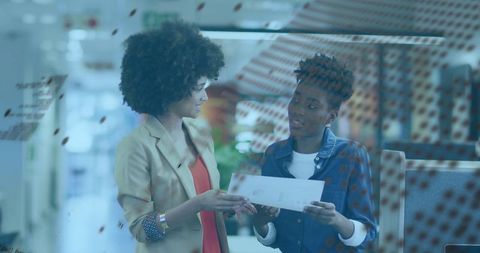 Dynamic Businesswomen Collaborating in Modern Office Space