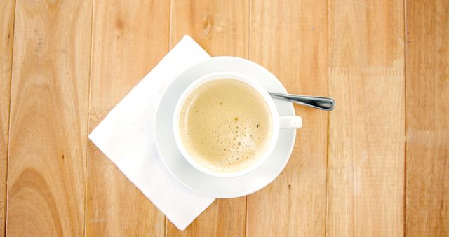 A freshly brewed cup of coffee sits on a wooden table, with copy space - Download Free Stock Photos Pikwizard.com