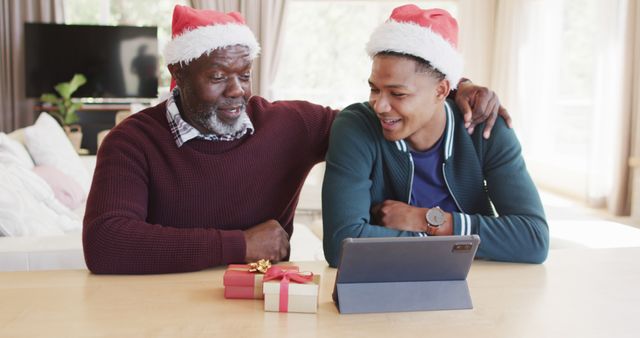 Father and Son with Santa Hats Connecting on Digital Tablet - Download Free Stock Images Pikwizard.com