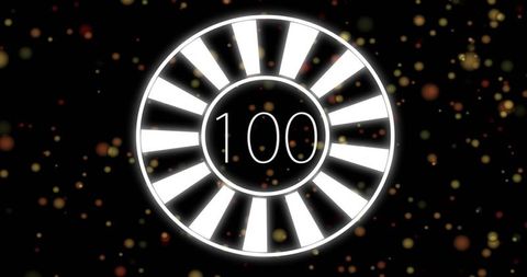 Glowing segmented ring displaying 100 with warm bokeh particles on dark background