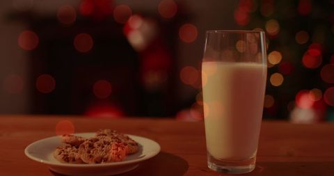 Festive Christmas Cookies and Milk with Bokeh Lights - Download Free Stock Images Pikwizard.com