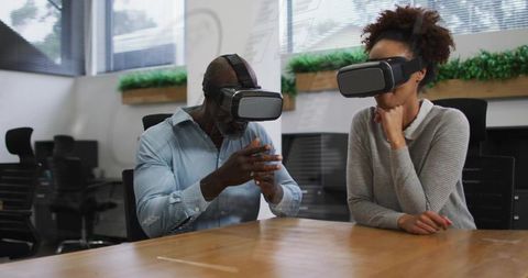 Business Team Collaborating with VR Headsets for Innovation and Training in Modern Office