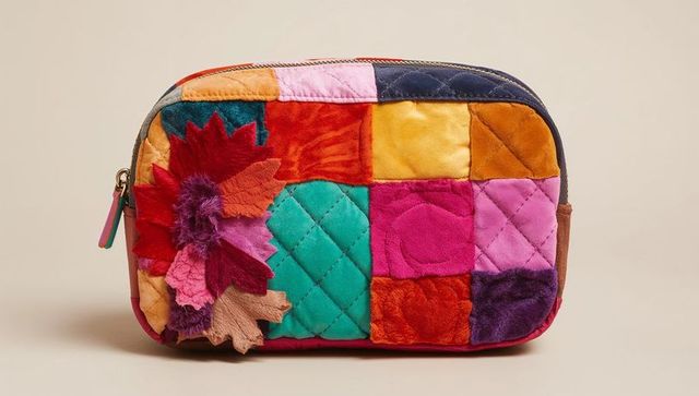Colorful patchwork quilted velvet makeup pouch featuring floral applique