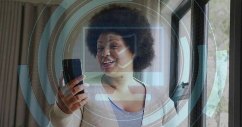 Woman using smartphone with augmented security hud for smart home interaction