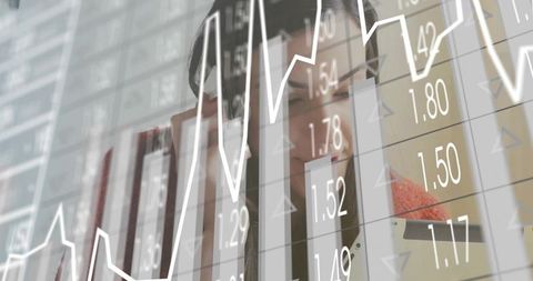 Businesswoman Analyzing Graphs Through Digital Interface