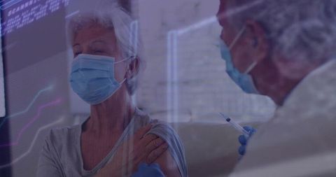 Senior Woman Receiving Vaccine from Healthcare Professional