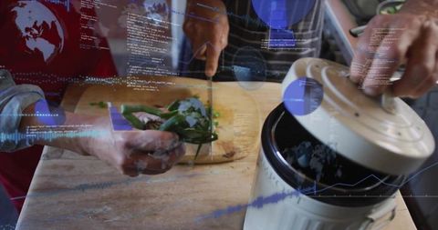 Couple chopping basil together while opening compost bin with digital data overlays