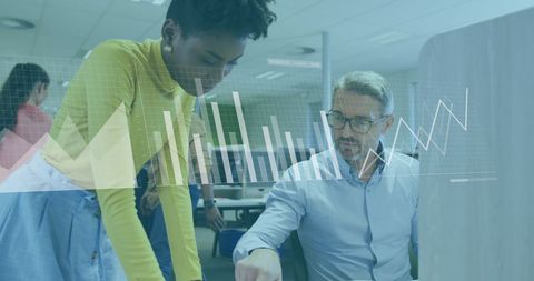 Diverse Colleagues Analyzing Business Data in Modern Office