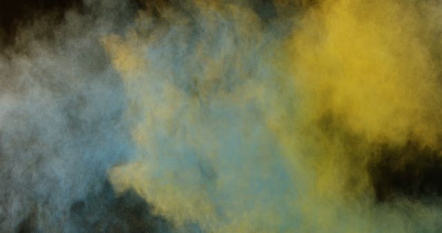 A vibrant display of yellow and blue smoke blending together to create an abstract background, with copy space. The interplay of colors can be used for creative projects or as a metaphor for mixing elements.