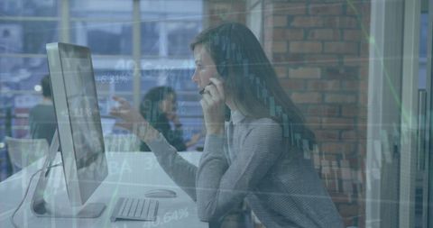 Businesswoman Analyzing Financial Data at Modern Workplace - Download Free Stock Images Pikwizard.com