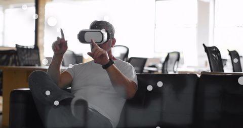 Businessman Experiencing Virtual Reality in Modern Office