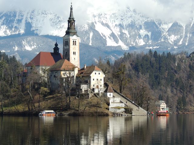 Picturesque Church on Lake Bled with Snow-Capped Mountains - Download Free Stock Photos Pikwizard.com