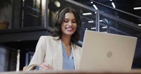 Smiling Businesswoman Video Calling in Modern Office - Download Free Stock Images Pikwizard.com