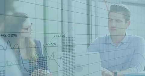 Colleagues Analyzing Financial Data in Modern Office Setting - Download Free Stock Images Pikwizard.com