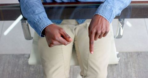 Business Professional Gesturing During Team Meeting