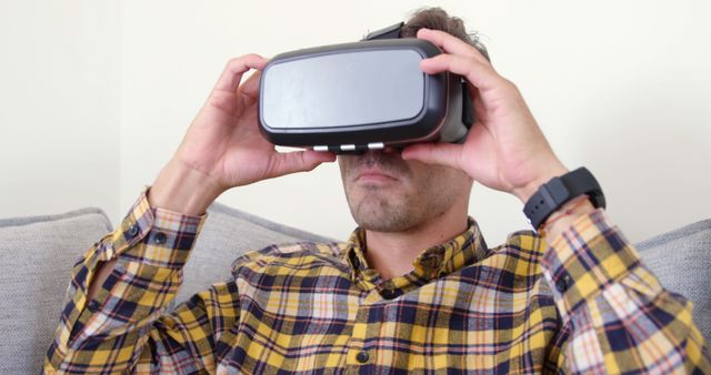 Man Using Virtual Reality Headset at Home - Download Free Stock Images Pikwizard.com