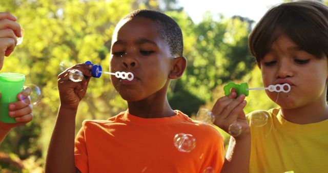 Children Blowing Bubbles Outdoors in Sunny Park - Download Free Stock Images Pikwizard.com