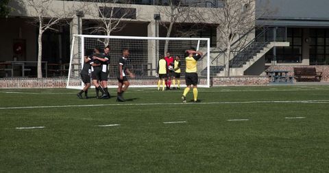 Soccer Team Collaborating During Practice on Bright Day