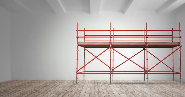 This image shows red scaffolding set up in an empty room with a wooden floor and white walls. The minimalist space focuses on industrial design and construction elements. It can be used for advertising construction services, promoting interior design ideas, or showcasing renovation projects.
