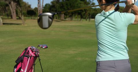 Golfer Swinging on Sunny Day at Golf Course - Download Free Stock Images Pikwizard.com