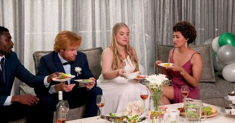 Wedding Celebration Friends Sharing Food in Living Room