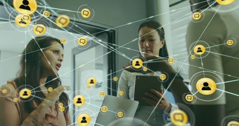 Digital network icons overlaying office discussion