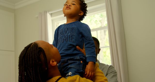 Parents Playing with Happy Child at Home - Download Free Stock Images Pikwizard.com