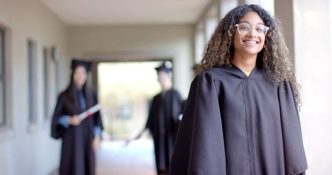 Proud Graduate Celebrating High School Achievement in Gown - Download Free Stock Images Pikwizard.com