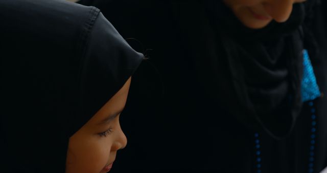 Muslim Woman and Young Girl in Traditional Clothing Spending Quiet Time Together - Download Free Stock Images Pikwizard.com