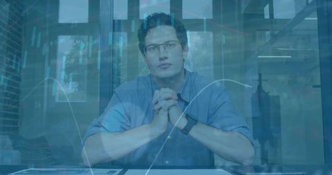 Businessman Analyzing Financial Data Insights in Modern Office