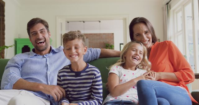 Happy Family Relaxing on Couch At Home - Download Free Stock Images Pikwizard.com