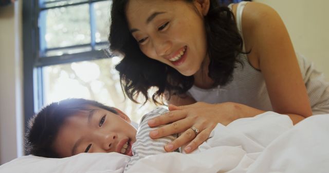 Mother Bonding with Child during Morning Time in Bed - Download Free Stock Images Pikwizard.com