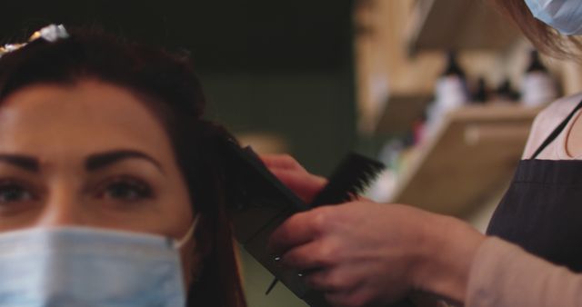 Woman Wearing Face Mask Receiving Haircut at Hair Salon - Download Free Stock Images Pikwizard.com