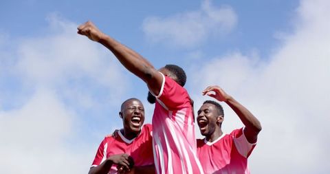 Youthful Soccer Players Joyfully Celebrating Victory Together