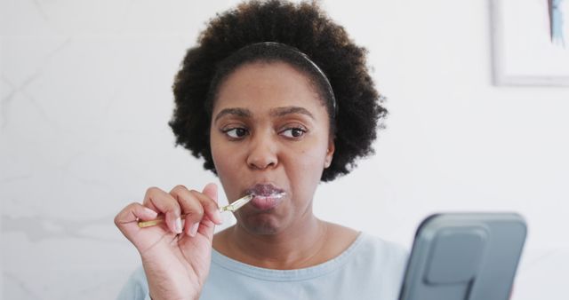 Woman Brushing Teeth with Electric Toothbrush in Front of Mirror - Download Free Stock Images Pikwizard.com