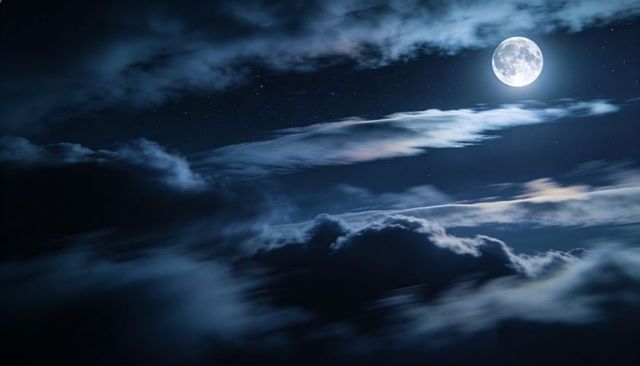 Full moon casting luminous glow over layered clouds in deep blue night sky with stars