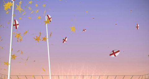 Rugby balls marked with the England flag soar above a stadium at sunset with golden stars adding a festive touch against a pink-hued sky. The empty rugby posts stand tall, ready for play. Ideal for sports promotional materials, social media campaigns, and event advertising highlighting England's participation in rugby events.