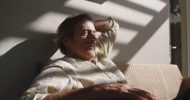 Senior Man Relaxing in Sunny Patio, Enjoying Peaceful Afternoon - Download Free Stock Images Pikwizard.com