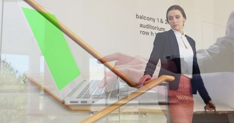 Businesswoman and Green Screen Laptop in Office Environment - Download Free Stock Images Pikwizard.com